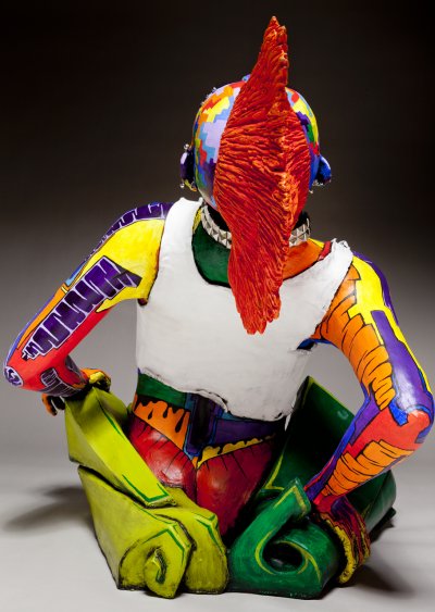 rear view of ceramic sculpture of punk chick with colorful surface decoration